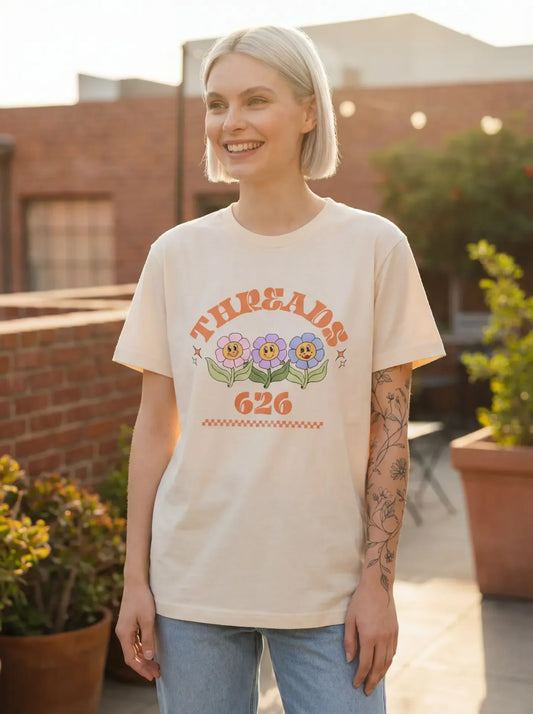 Women's Flower Vibe Sorona Eco Tee by Threads 626, featuring a floral design on a green eco-friendly cotton t-shirt.